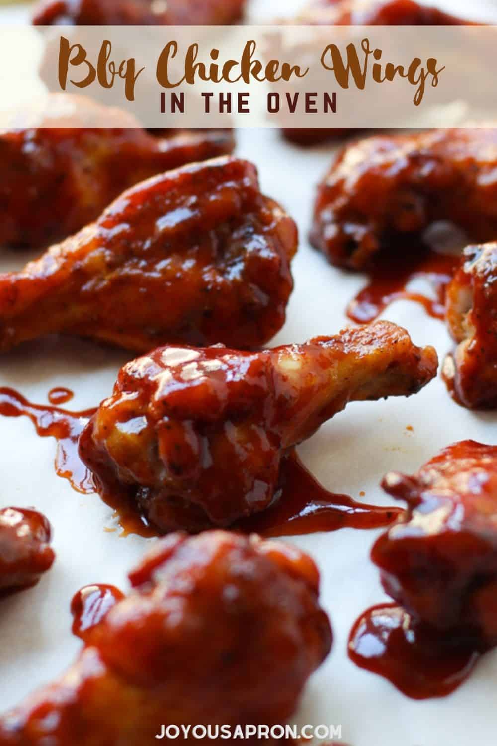 BBQ Baked Chicken Wings - these chicken wings are easy to make, oven baked AND crispy! Then smothered with barbecue sauce. The perfect appetizer or main course for parties, game day, any day! via @joyousapron