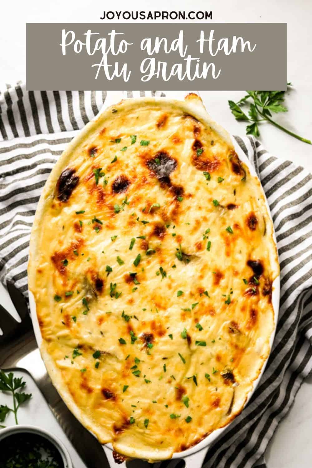 Potato and Ham Au Gratin - Creamy and rich cheesy potatoes layered with ham slices, oven baked to perfection! This delicious comfort food potato casserole dish is perfect for the holidays! via @joyousapron