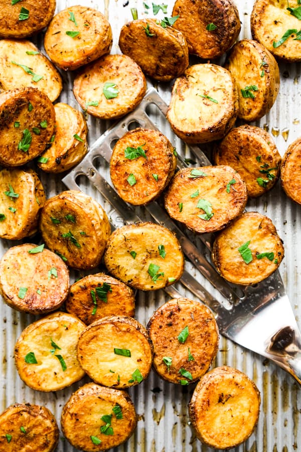 Top down view of roasted small potatoes cut in halves