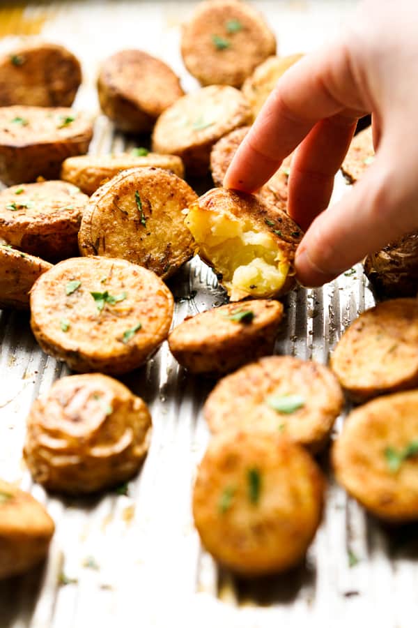 baby potato that is being cut into showing the soft and tender insides