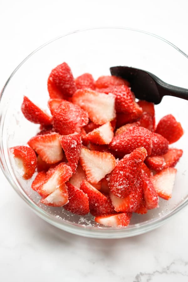 strawberry, sugar mixture in a bowl before refrigerating