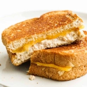 Two slices of grilled cheese tuna melt on a plate