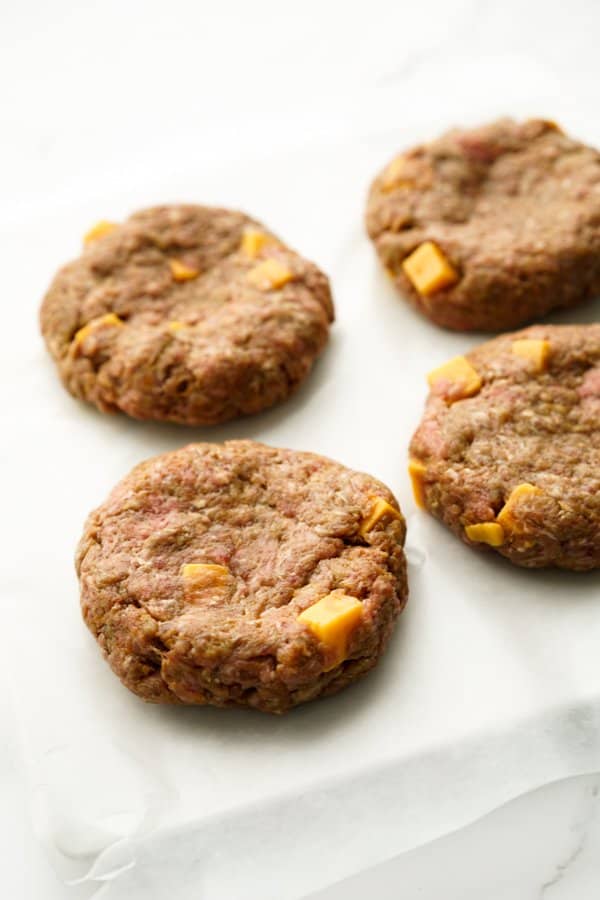 Raw beef patties with cheese