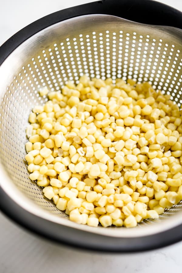 Corn kernels in a colander 