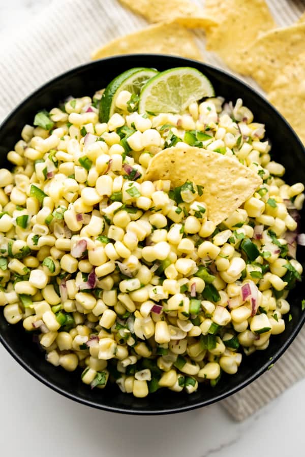 Top down view of a bowl of Chipotle corn jalapeño salsa
