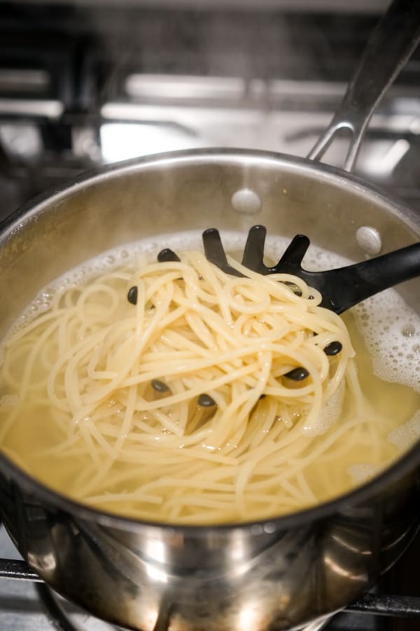Boil spaghetti noodles in pot