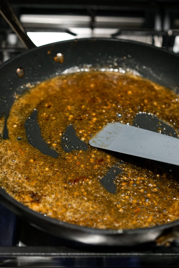 Making sauce for garlic noodles in a skillet