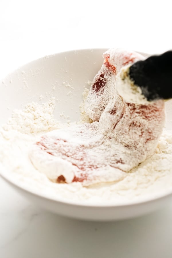 Pork chops coated in flour mixture