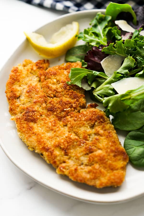 Pork cutlet Milanese served with a salad