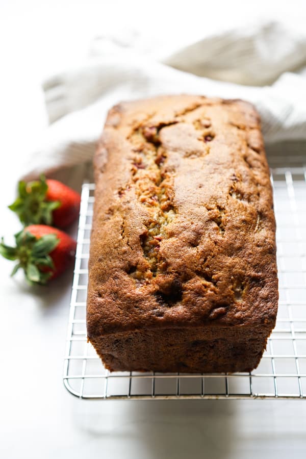 Cooling strawberry banana bread on a cooling rack