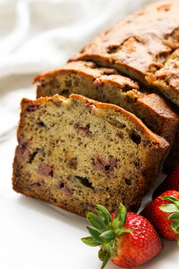 Zoom in on a slice of banana bread with strawberries
