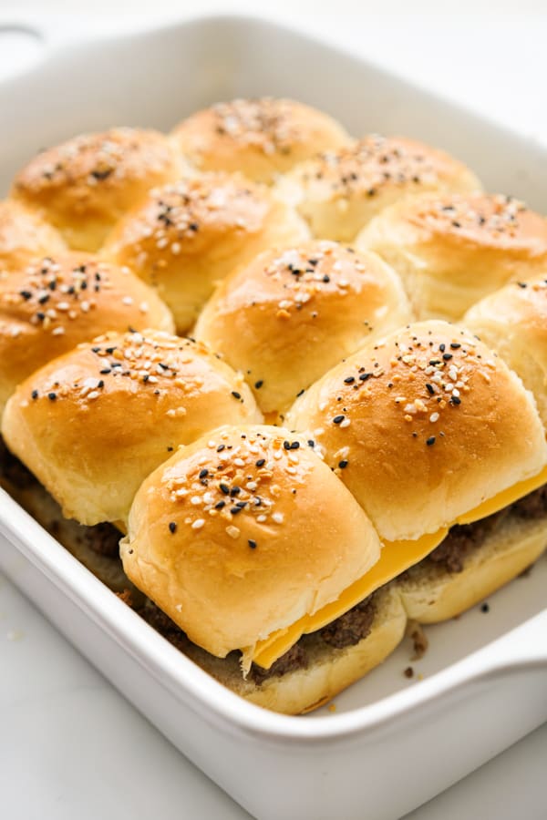 Unbaked Bacon cheeseburger sliders in hawaiian rolls