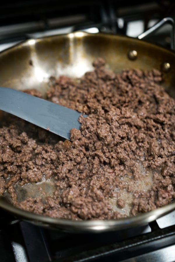 Stir frying ground beef in a skillet