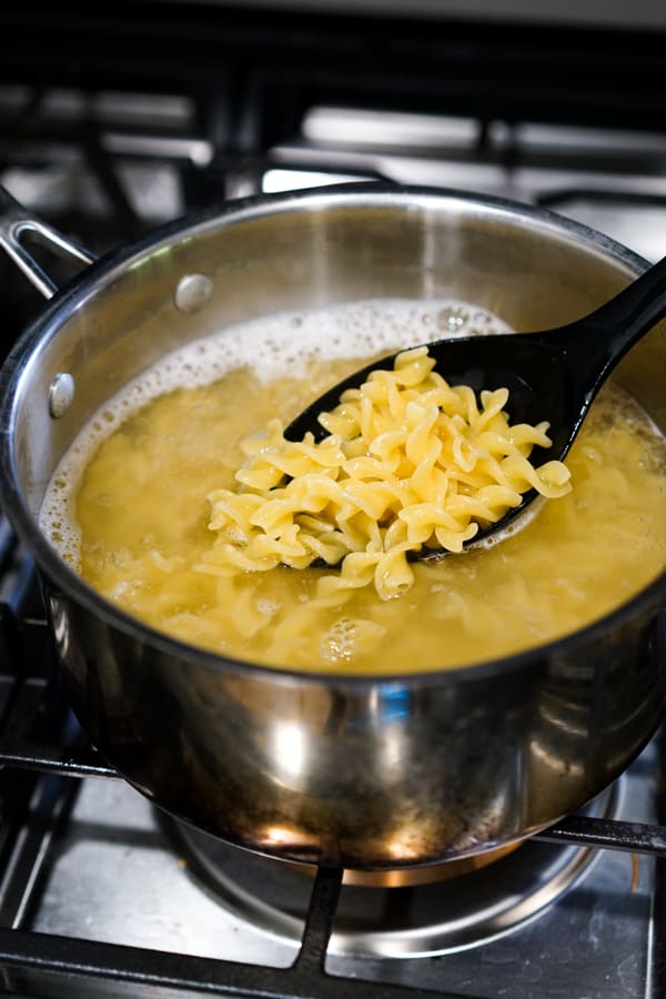 Cooking pasta in boiling water in a pot