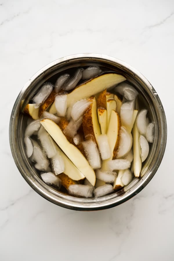 potato wedges soaked in ice bath