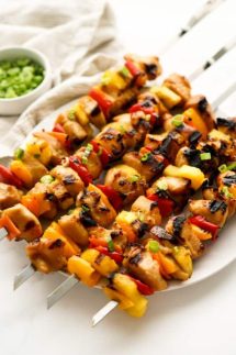 Grilled chicken kebobs, pineapple, bell peppers on sticks