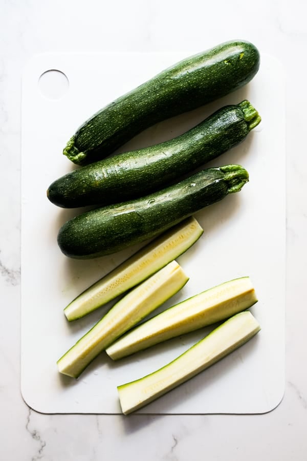 whole zucchini and zucchini spears sliced into quarters