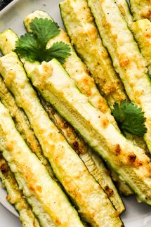 ZUcchini sticks on a plate, baked with golden brown top