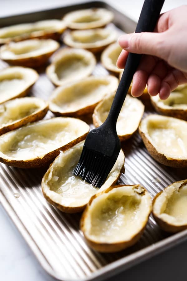 Brushing potato skin with butter
