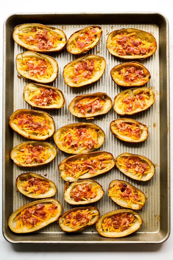 Potato skins loaded with bacon bits and cheddar cheese