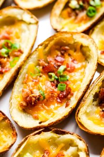 Crispy potato skin topped with bacon, cheese and green onions
