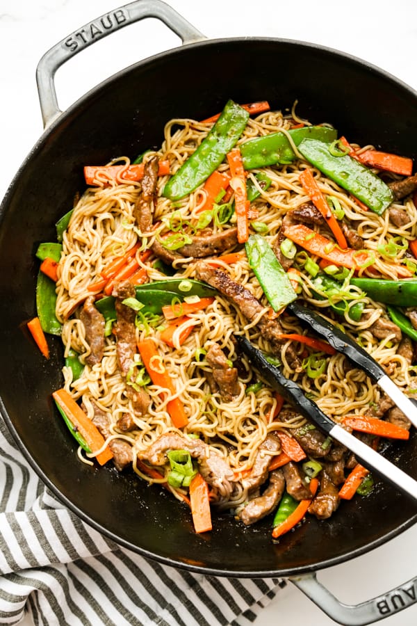 Top down view of a large wok with Mongolian Beef Noodles