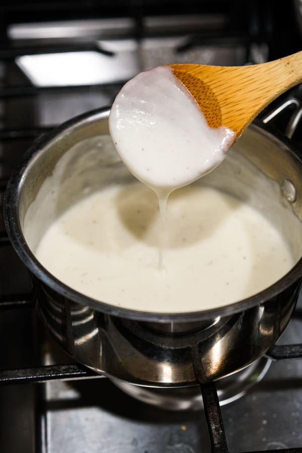 Making cream sauce in a pot on the stove