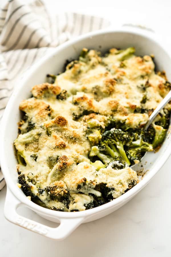 Broccoli au Gratin in an oval casserole dish.