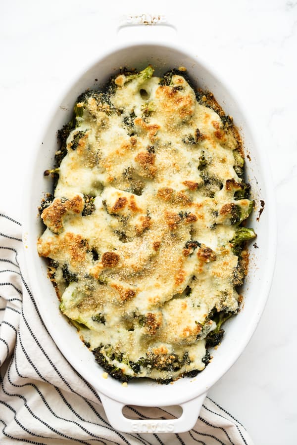Broccoli au Gratin with a golden brown topped in an oval casserole dish