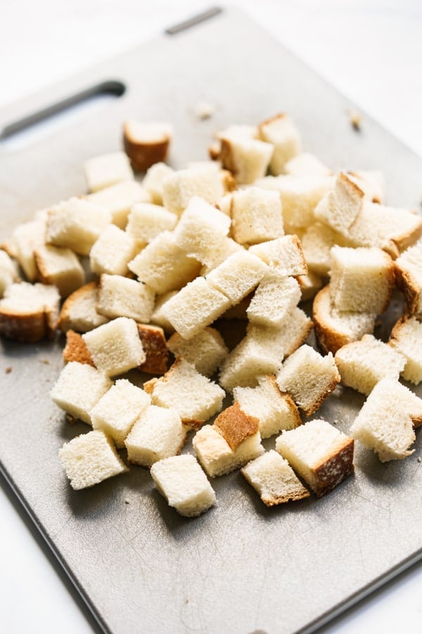 cubes of bread on grey cutting board
