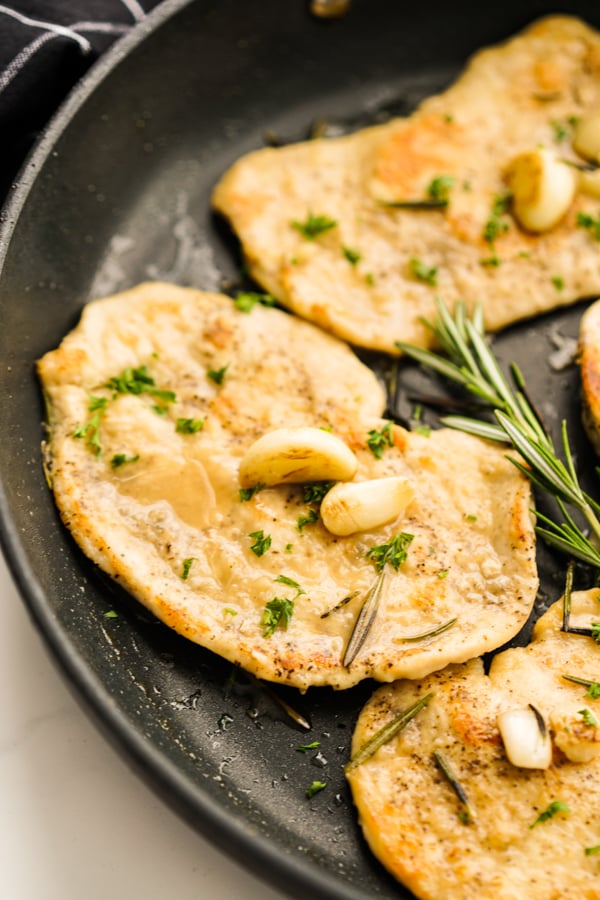 Close up show of a slice of Garlic rosemary chicken cutlet