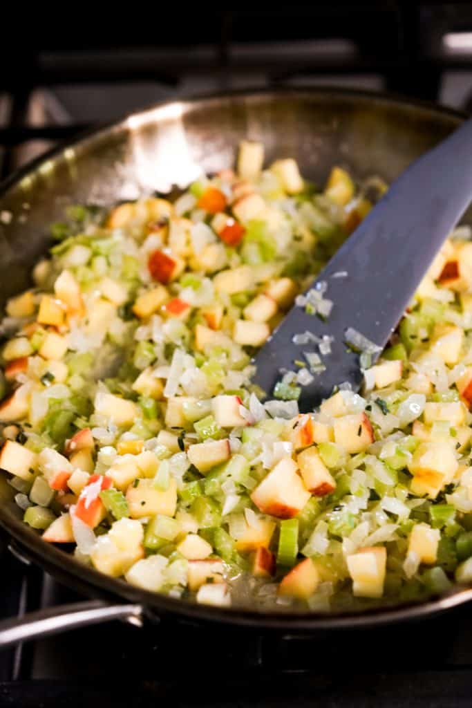 Sauteing onions, garlic, apples celery in frying pan