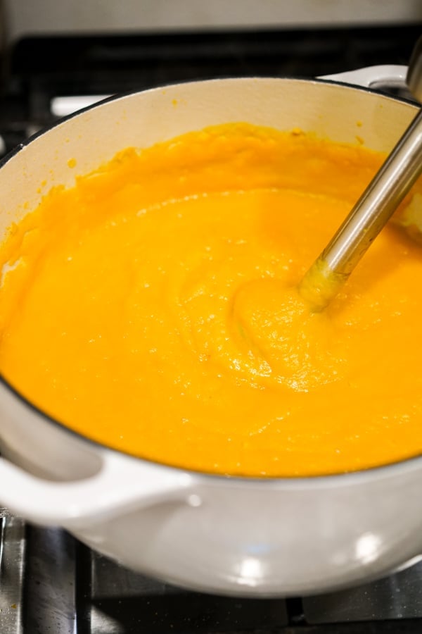 Blending butternut squash soup with immersion blender