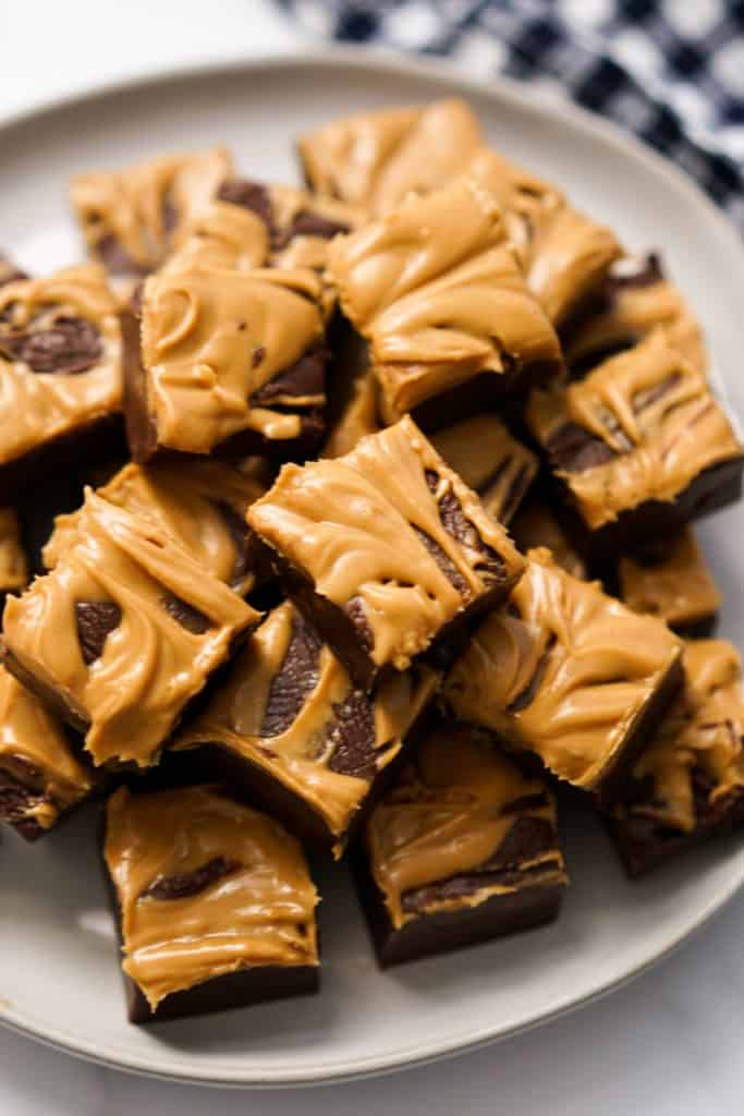 A plate of chocolate fudge with peanut butter swirls on top