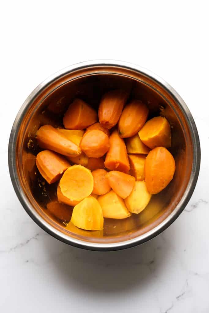 Soft sweet potatoes in a mixing bowl