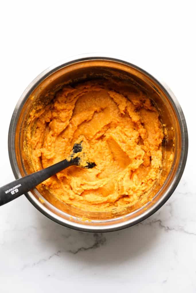 Creamy brown sugar mashed sweet potatoes in a large mixing bowl