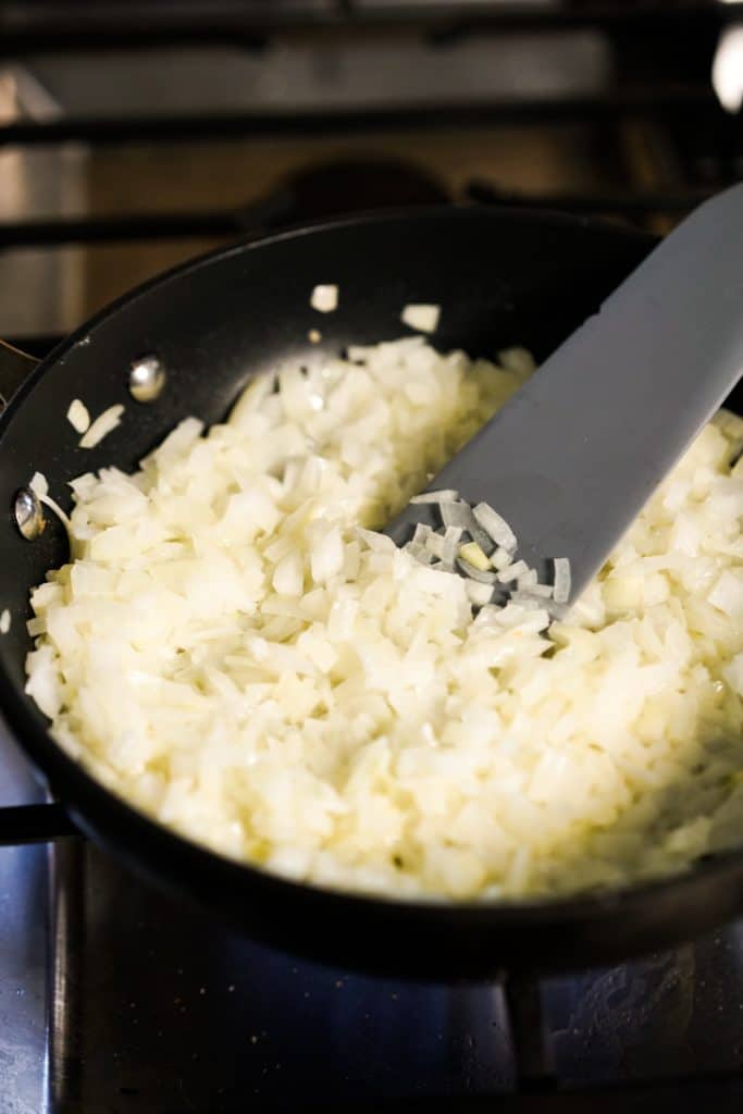 Pan frying raw onions in skillet