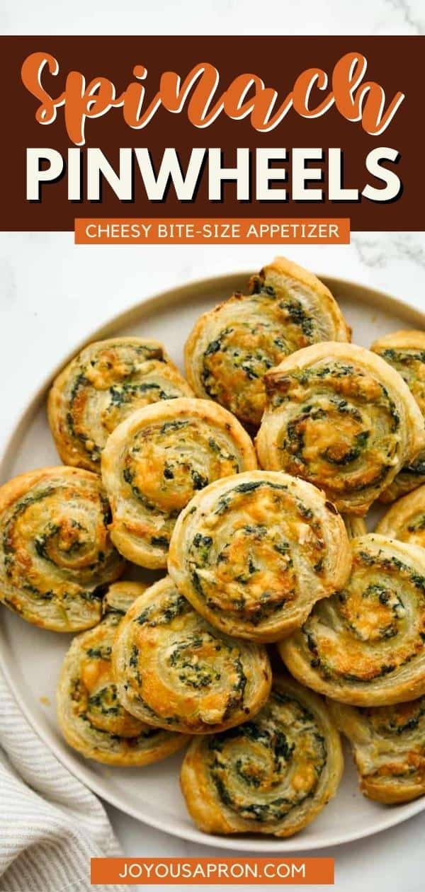 Spinach Pinwheels - easy party food, appetizer and finger food for game day and the holidays. Oven baked buttery puff pastry appetizers rolled with a cheesy cream cheese spinach mixture with caramelized onions. via @joyousapron