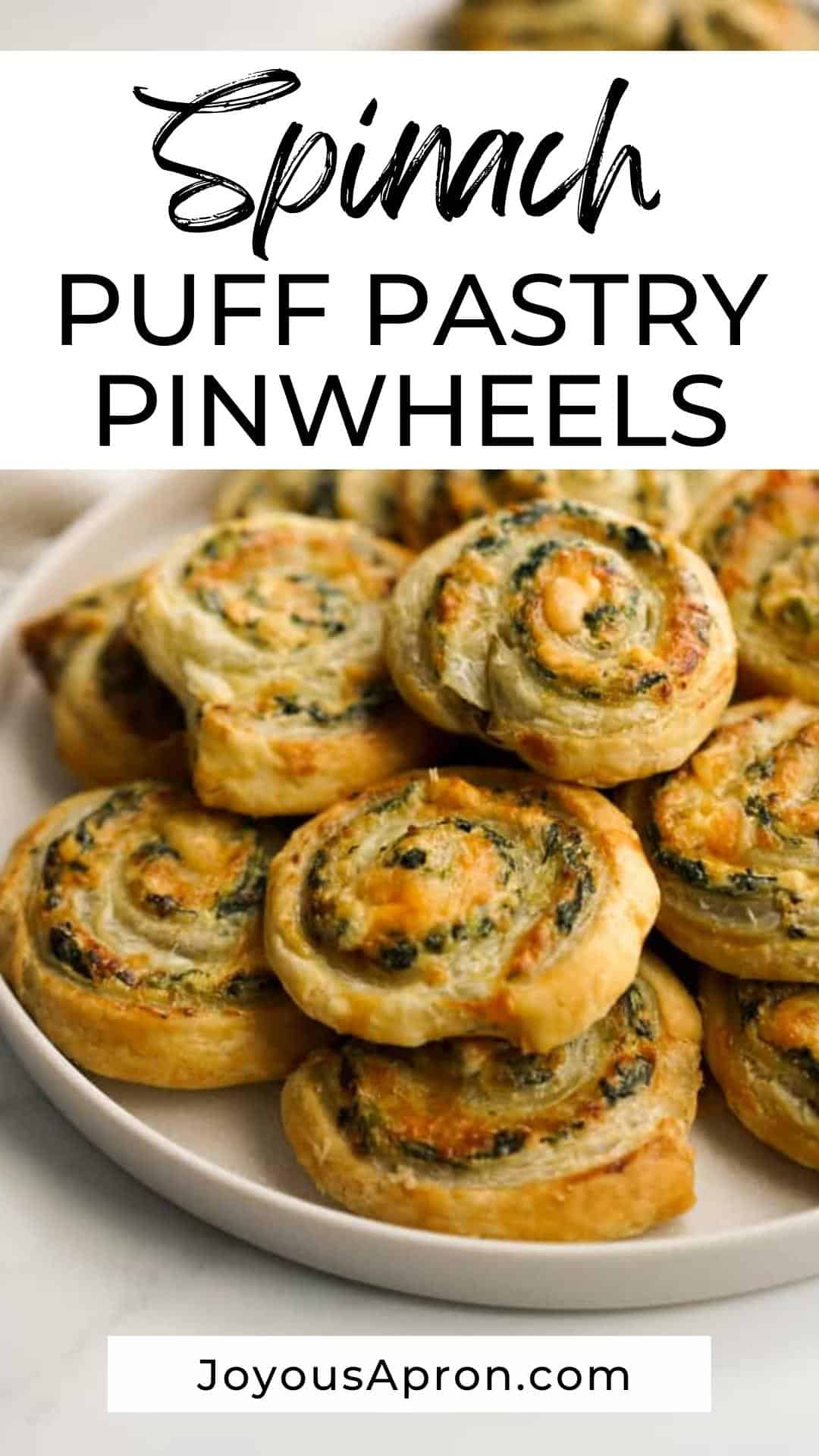 Spinach Pinwheels - easy party food, appetizer and finger food for game day and the holidays. Oven baked buttery puff pastry appetizers rolled with a cheesy cream cheese spinach mixture with caramelized onions. via @joyousapron