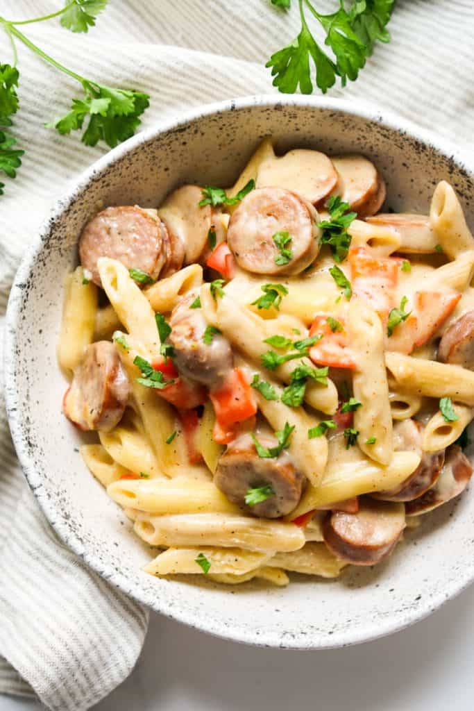 Closeup of a bowl of creamy cajun sausage pasta