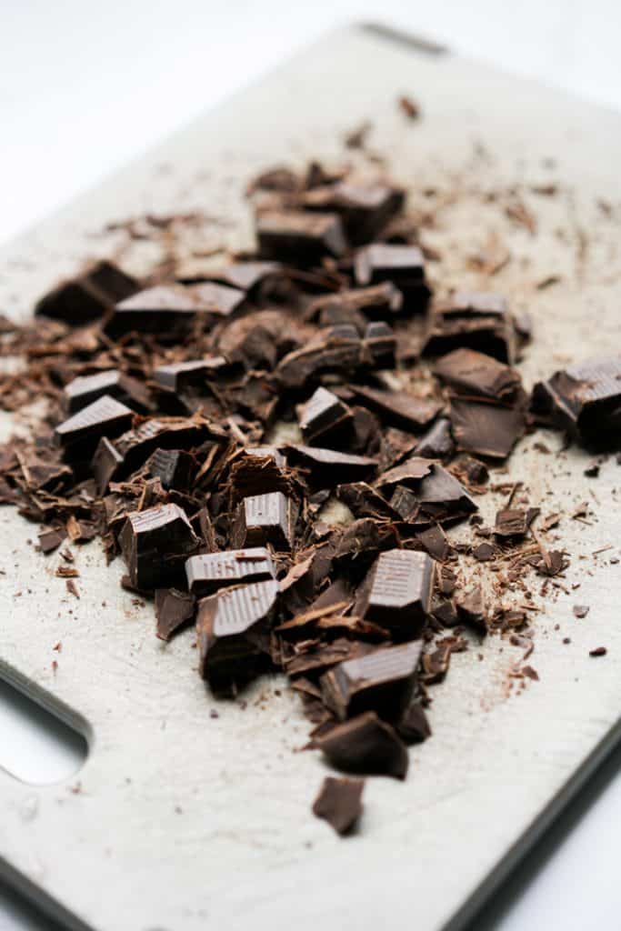 Chopped chocolate on cutting board