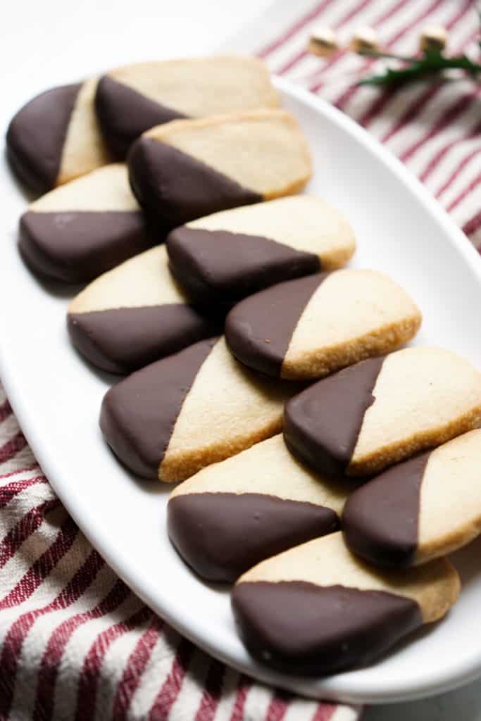 A platter of shortbread cookies dipped in chocolate