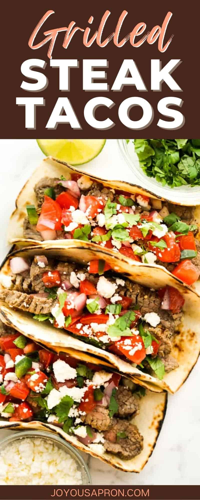 Grilled Steak Tacos - a simple beef taco recipe made on the grill or grill pan. Wrapped in flour tortilla and topped with tomatoes, jalepenos and lime juice mixture, queso fresco and more cilantro. Easy, healthy and delicious! Makes for an easy dinner meal. via @joyousapron