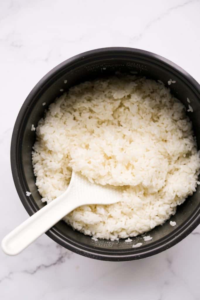 short grain sushi rice in a rice cooker bowl