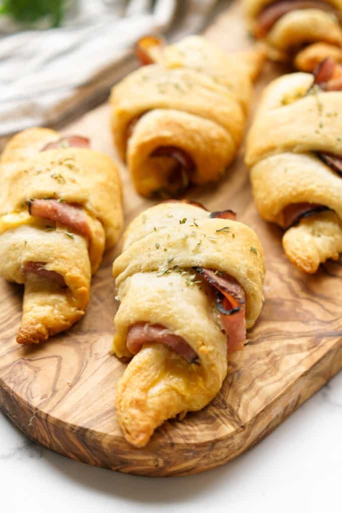 Crescent roll ups on a wooden platter