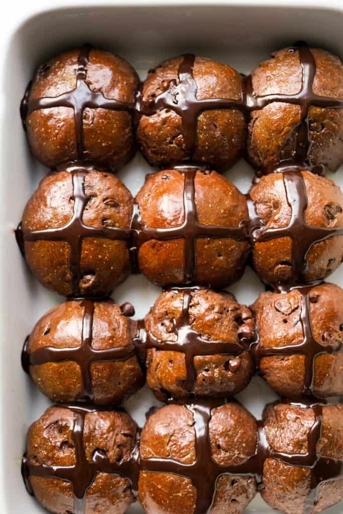 Top down view of chocolate buns with crosses on top