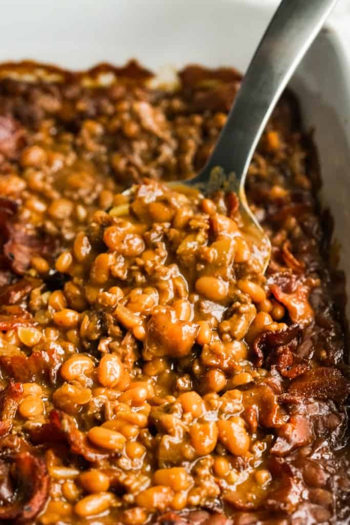 Scooping out some bbq baked beans