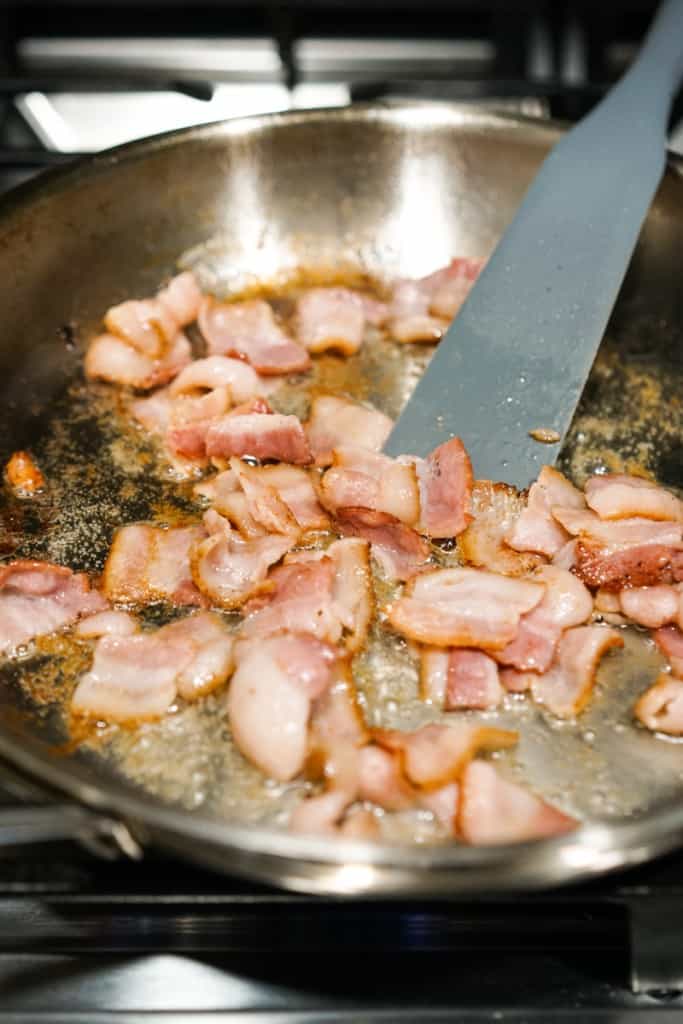 Pan frying bacon on skillet