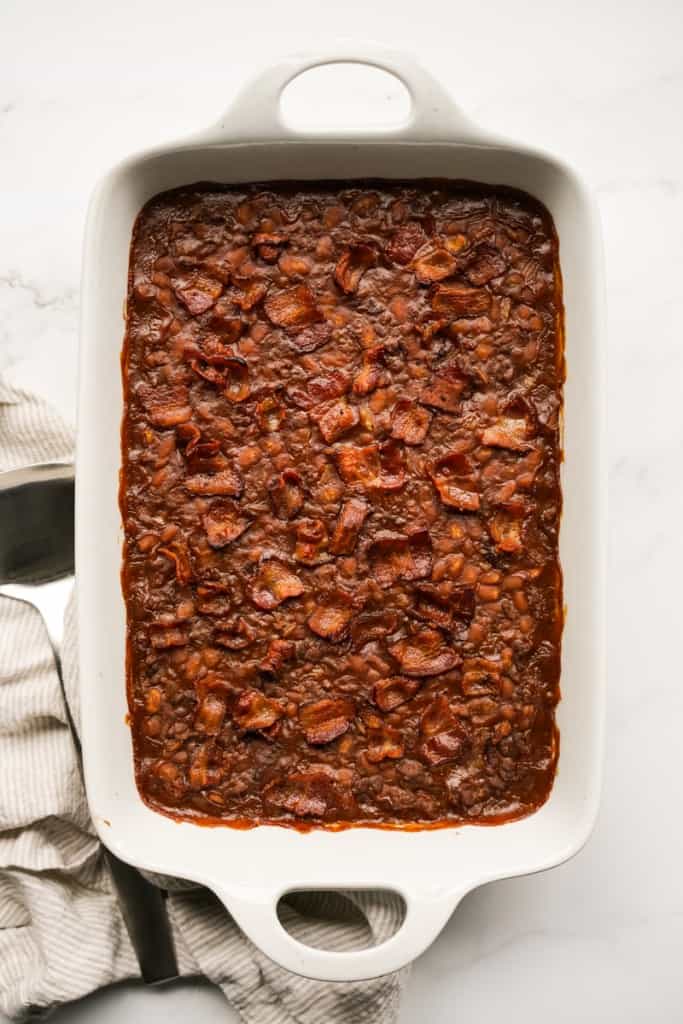 baked beans fresh off the oven that is topped with crispy bacon pieces
