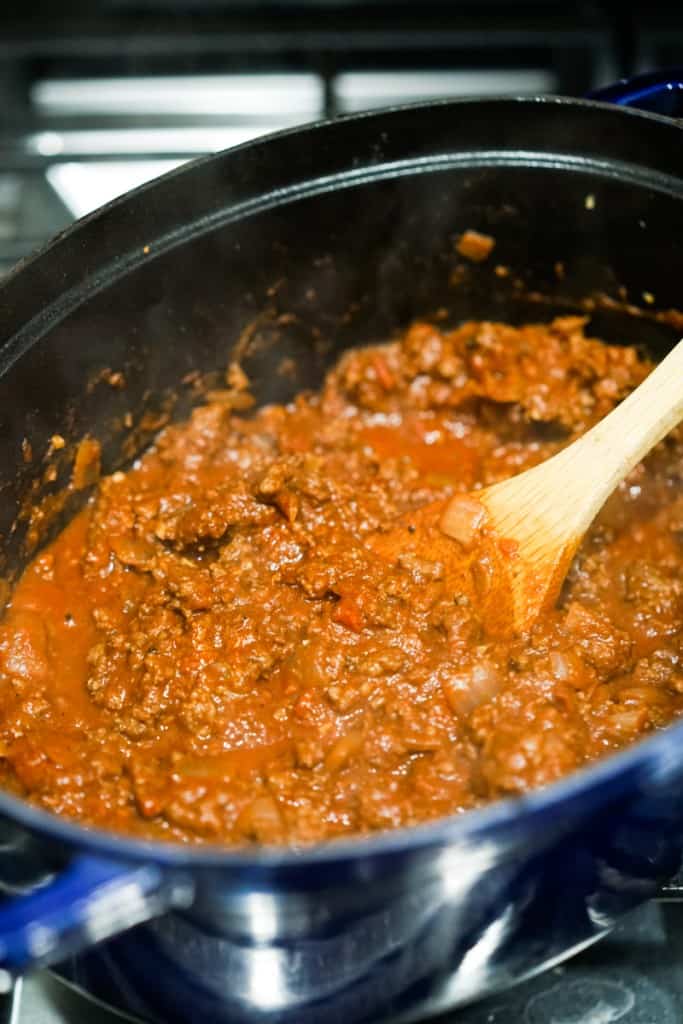 Cooking homemade chili in a Dutch oven